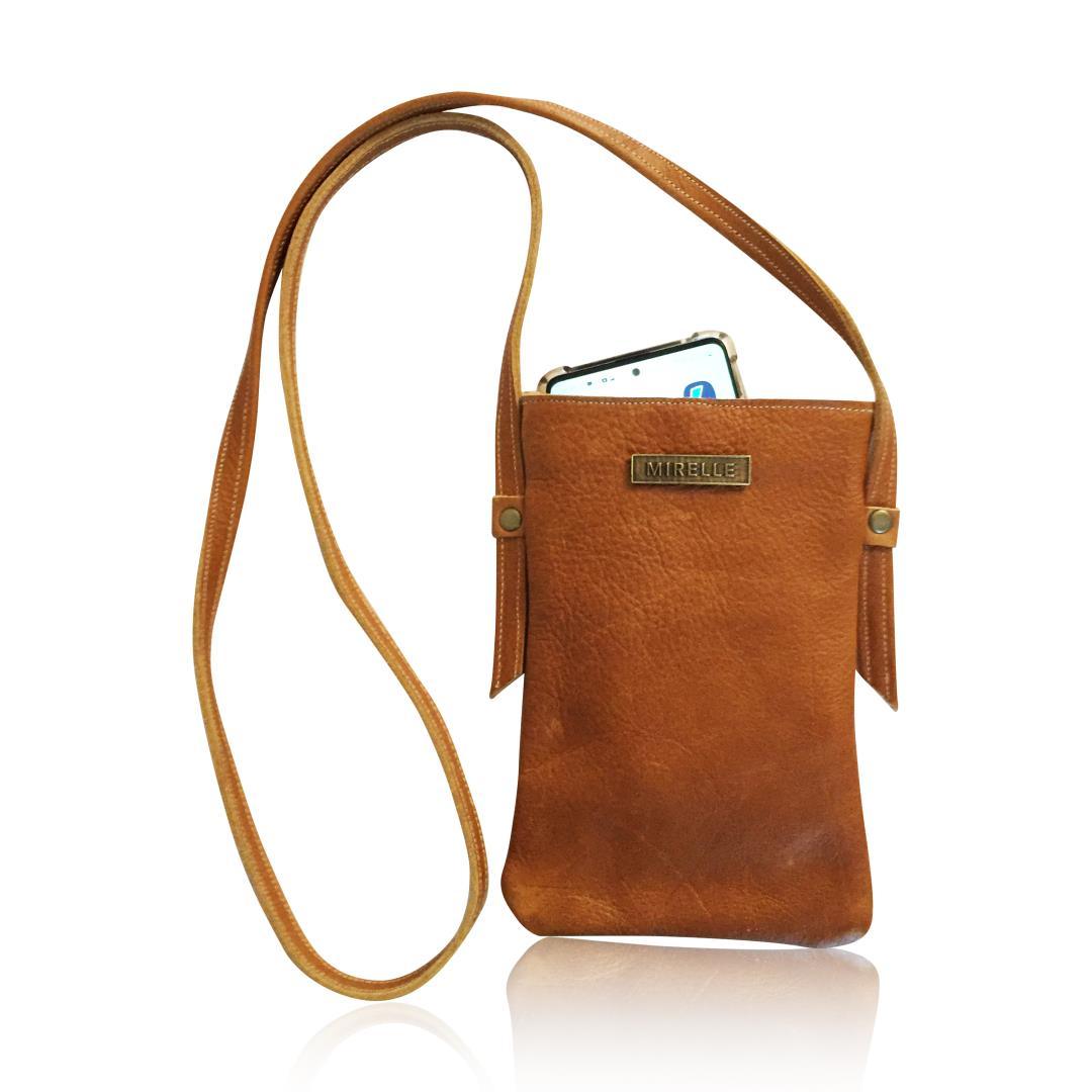 Mirelle genuine leather tan crossbody bag with long strap and phone inside, minimalist design
